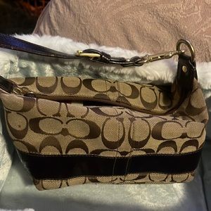 Authentic. coach mini arm pouch!! Beautiful multi color.  satin. inside!!